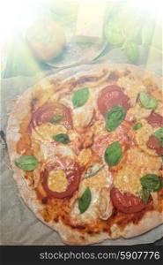 pizza margarita. rustic italian pizza with mozzarella cheese tomato and basil leaves