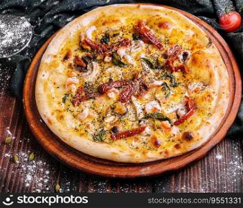 Pizza on wooden table on top view