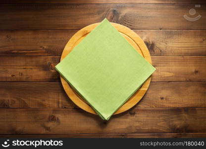 pizza or bread andcutting board  cloth at wooden table, top view