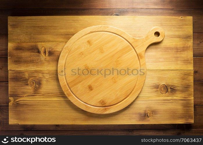 pizza or bread cutting board at wooden table, top view