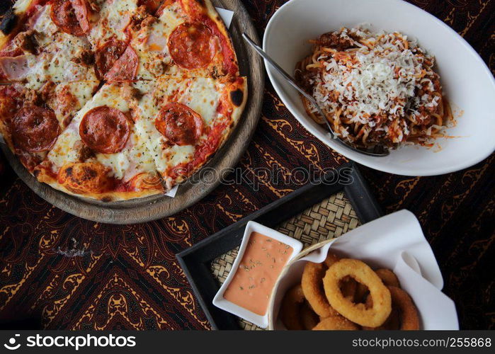 pizza pasta and onion ring on top view