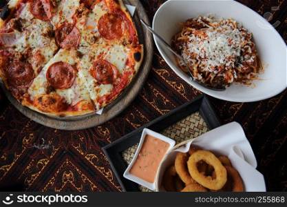 pizza pasta and onion ring on top view