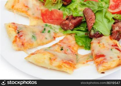 Pizza slices and salad. Pizza slices with melted cheese and fresh vegetable salad
