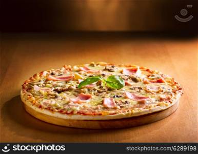 pizza with bacon and mushrooms on wooden background