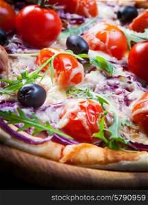 Pizza with cherry tomatoes and arugula