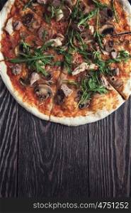 Pizza with chicken and mushrooms. Pizza with chicken mushrooms and rukkola