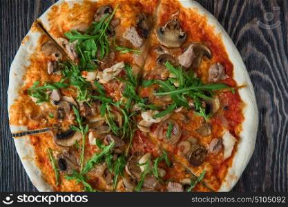 Pizza with chicken and mushrooms. Pizza with chicken mushrooms and rukkola