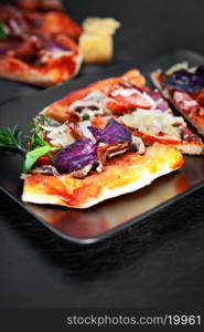 Pizza with Ham and Mushrooms on dark background