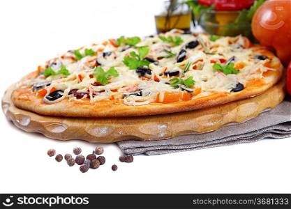 Pizza with ham, pepper and olives over white