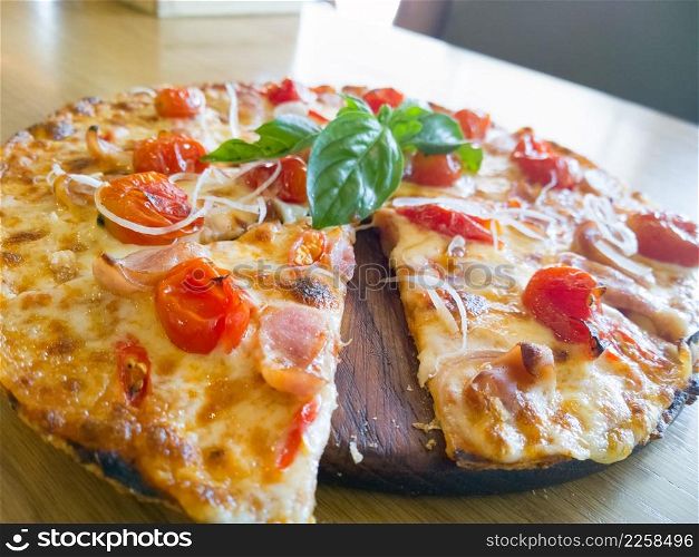 Pizza with ham, pepper and tomato