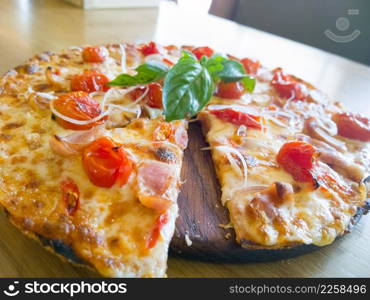 Pizza with ham, pepper and tomato