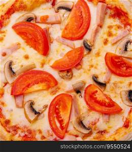 Pizza with ham, tomatoes and mushrooms on top view