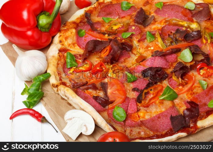 Pizza with ingredients closeup