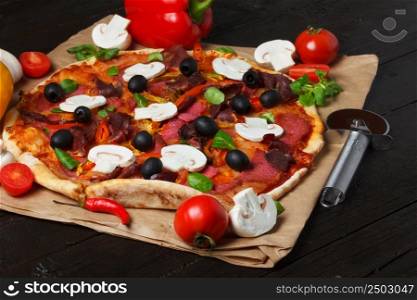 Pizza with ingredients on wooden table