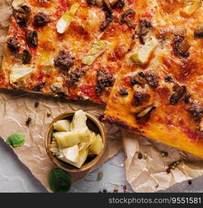 pizza with minced meat, artichokes and mushrooms