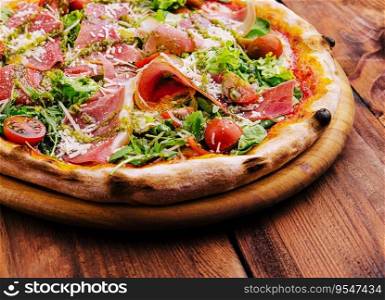 Pizza with prosciutto meat, cherry tomatoes, arugula and parmesan cheese