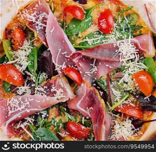 Pizza with prosciutto meat on wooden board