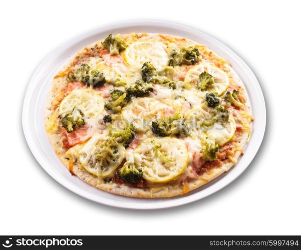Pizza with salmon, lemon and broccoli on the plate
