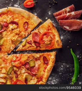 pizza with sausage, ham and chicken