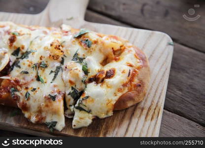 Pizza with seafood on wood background italian food