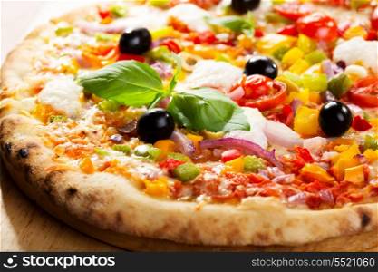 pizza with vegetables and green basil