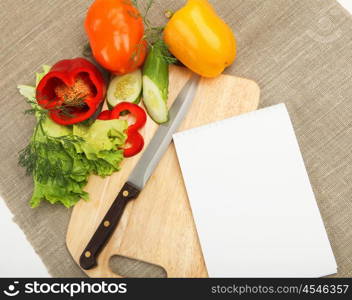 Place for cooking vegetables, vegetables, and a notebook. symbol of a healthy lifestyle.