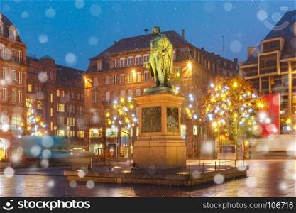 Place Kleber in Strasbourg, Alsace, France. Statue of Jean-Baptiste Kleber on the Christmas Place Kleber decorated and illuminated in Old Town of Strasbourg at night, Alsace, France