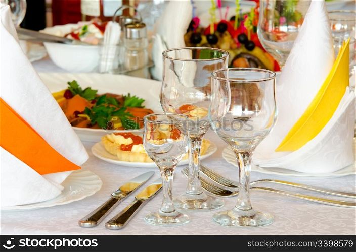 place setting at a laid restaurant banquet table