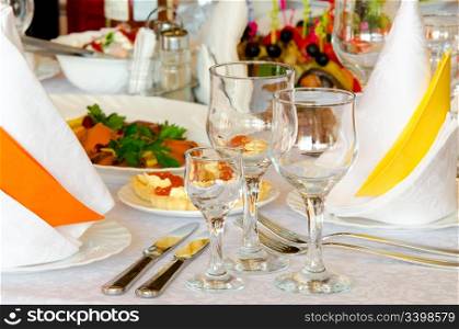 place setting at a laid restaurant banquet table