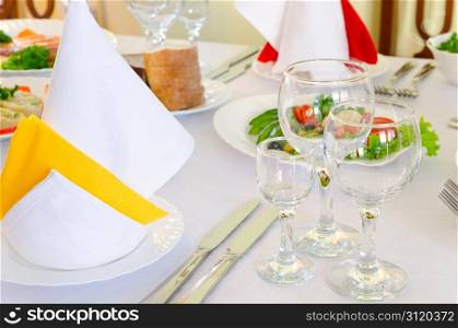 place setting at laid restaurant banquet table
