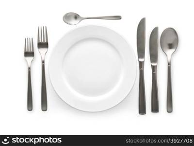 Place setting with plate, knife and fork. on white background