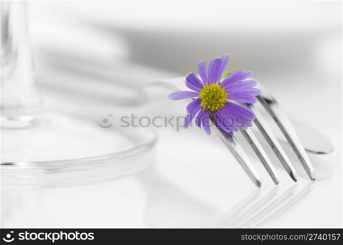 Place setting with purple flower. Health and diet concept