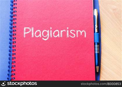 Plagiarism text concept write on notebook with pen