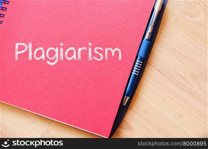 Plagiarism text concept write on notebook with pen