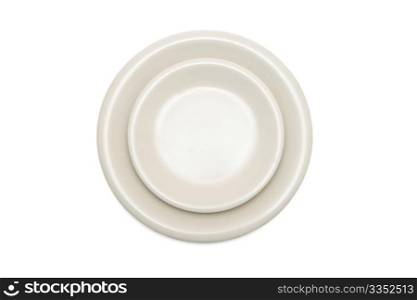 Plain beige dinner plate and saucer isolated top view