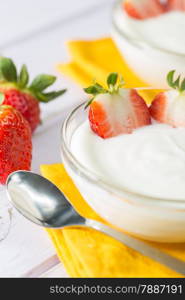 Plain yogurt with delicious fresh strawberries