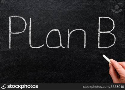 Plan B written with white chalk on a blackboard.
