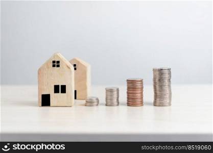 Plan finances investments and savings to buy house real estate.Money coin and home on table business accounting and tax and insurance concept.