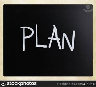 ""Plan" handwritten with white chalk on a blackboard"