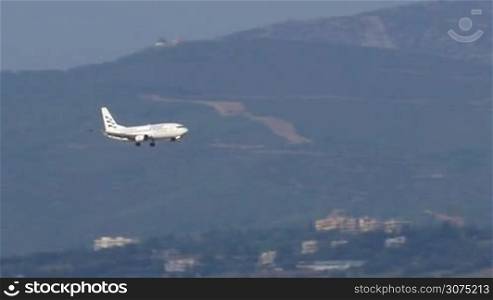 Plane of Ellinair (airline company is a part of Mouzenidis group) is approaching to land and landing-on