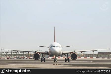 Plane on the runway. Frontal view