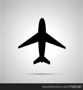 Plane simple modern black icon with shadow. Plane simple black icon
