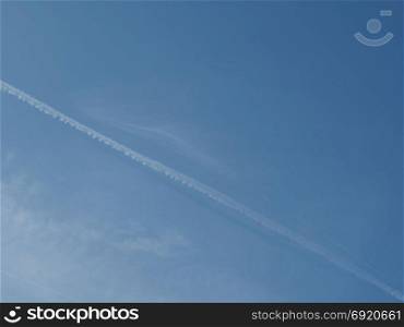 plane trails in the sky. blue sky with plane vapour trails (aka contrails, short for condensation trails)