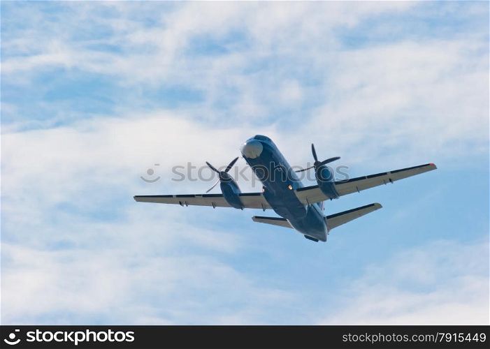 plane with propeller soars into the sky