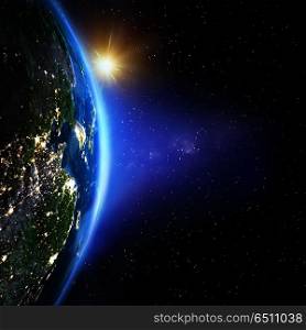 Planet Earth from space sunrise. Planet Earth from space sunrise. Elements of this image furnished by NASA. Planet Earth from space sunrise