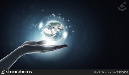 Planet in hands. Human hand holding digital icon of planet earth. Elements of this image are furnished by NASA