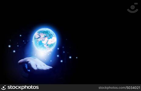 Planet in hands. Human hand holding digital icon of planet earth. Elements of this image are furnished by NASA