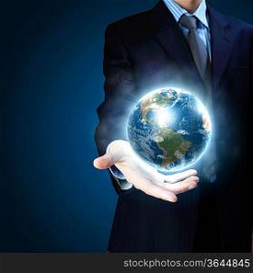 Planet System in Your Hand. Conceptual Image. Elements of this image furnished by NASA.
