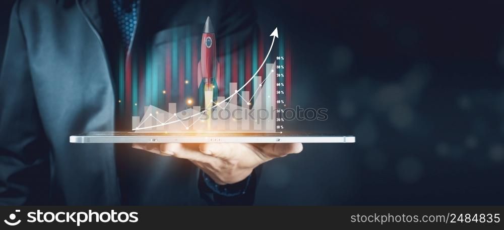 Planning and strategy, stock market, business growth, progress or success idea. Businessman or trader is showing growing virtual hologram stocks, invest in trading.