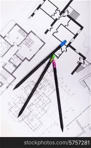 Plans for residential flats with pencil closeup